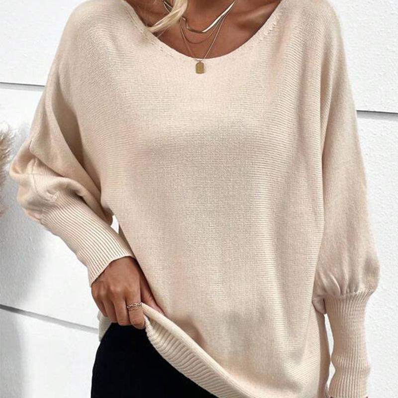 Zoe - Elegancki i luźny morelowy sweter damski