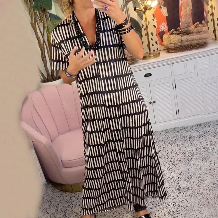 Ilse - Nowoczesna sukienka maxi z krótkim rękawem i dekoltem w szpic