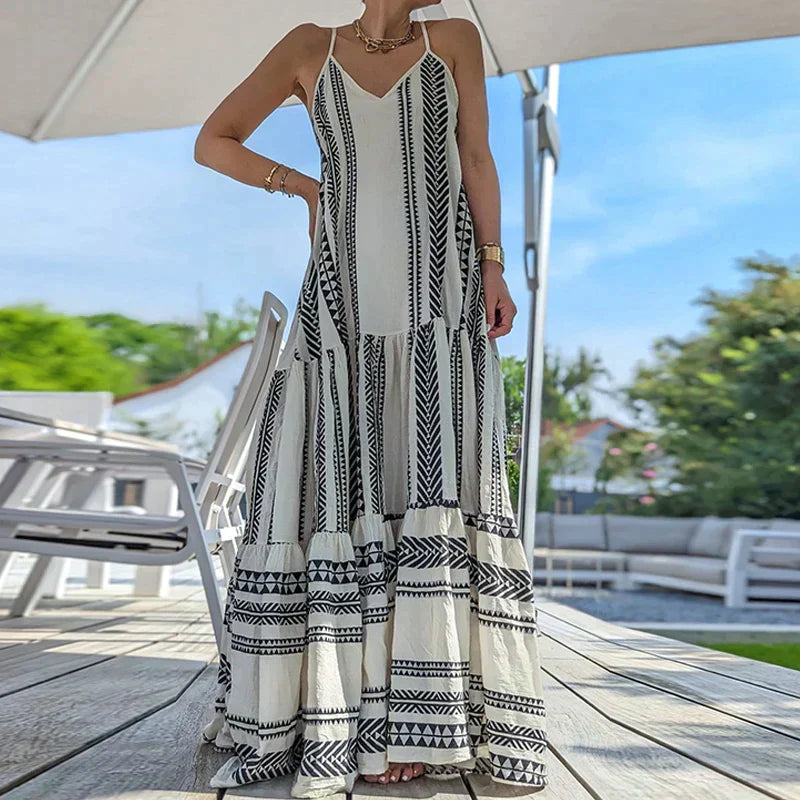 Debbie - Elegancka sukienka bez rękawów z falbanami i swobodnym nadrukiem