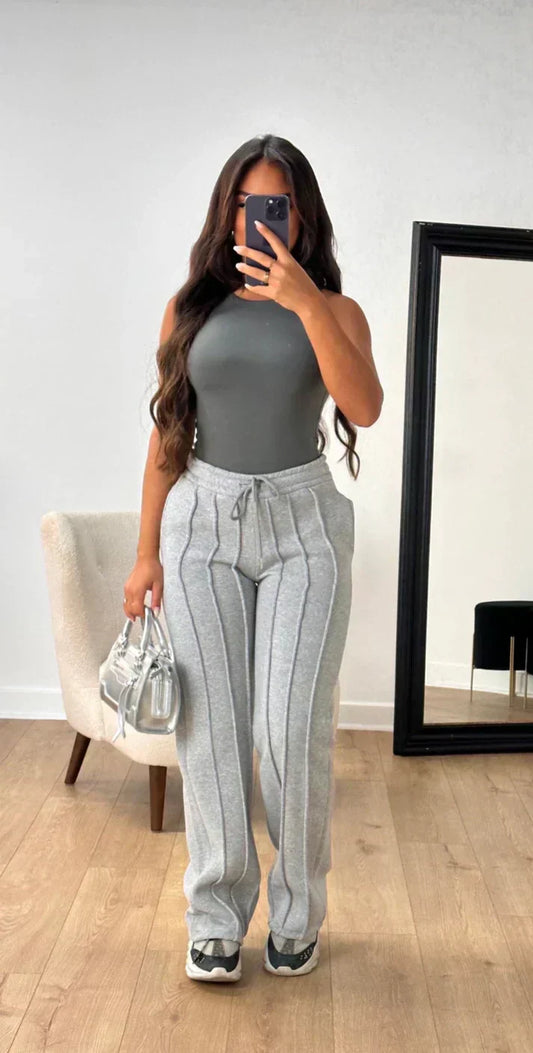 Athena - Damskie spodnie dresowe w paski