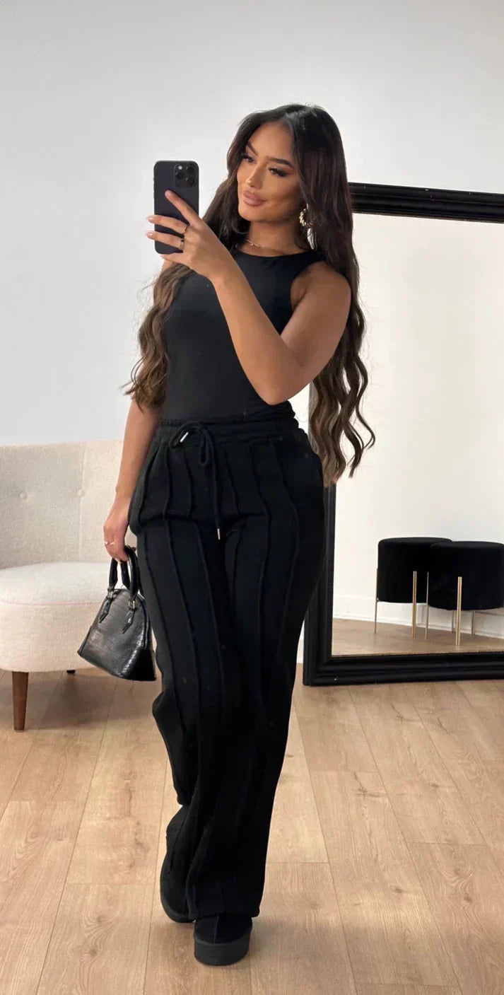 Athena - Damskie spodnie dresowe w paski