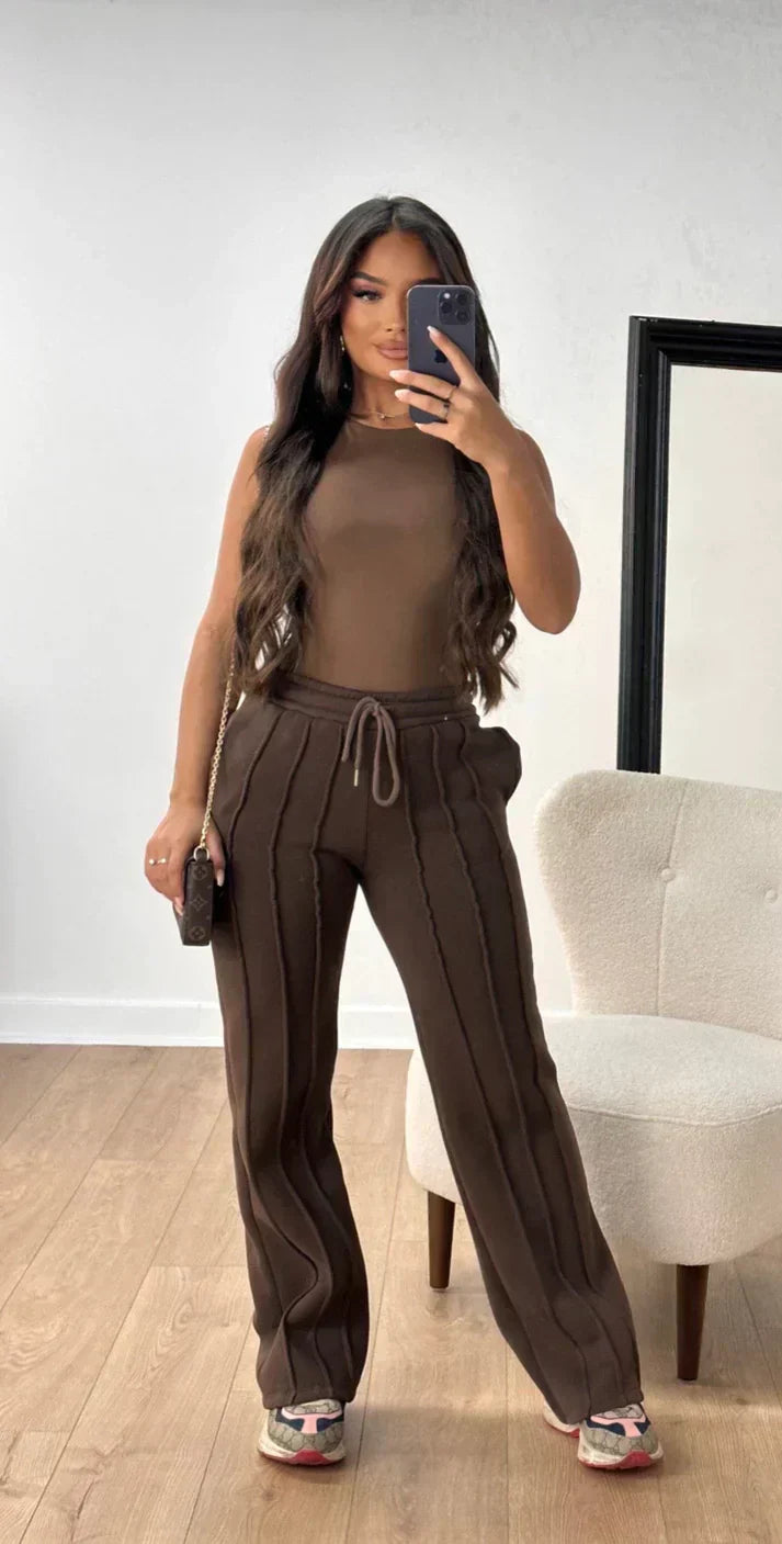 Athena - Damskie spodnie dresowe w paski