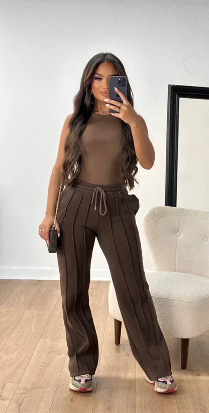 Athena - Damskie spodnie dresowe w paski