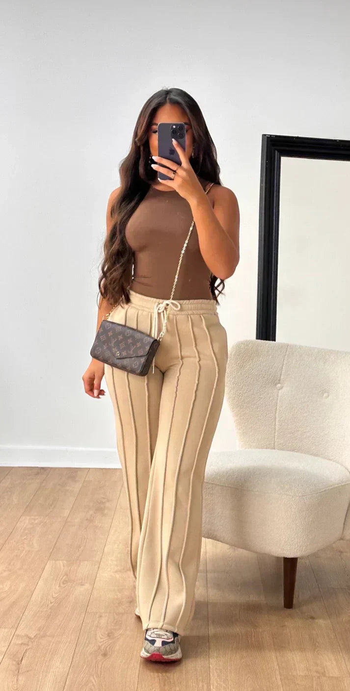 Athena - Damskie spodnie dresowe w paski
